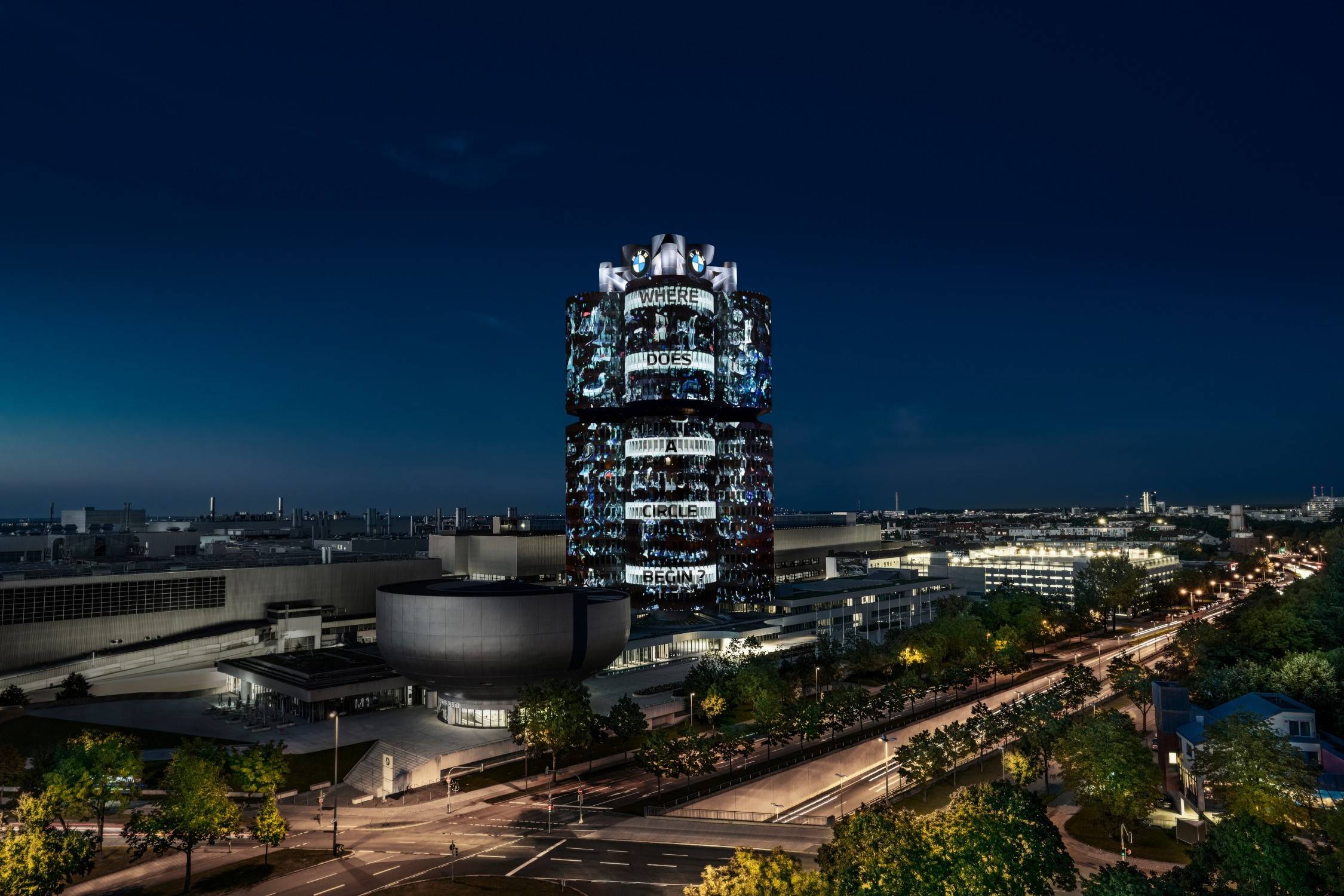 宝马总部四缸大厦照亮慕尼黑夜空,传达可持续,循环经济和电动出行的
