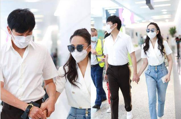 青春 伊能静牵老公现身机场,卷发配牛仔裤青春减龄,两人看不出年龄差