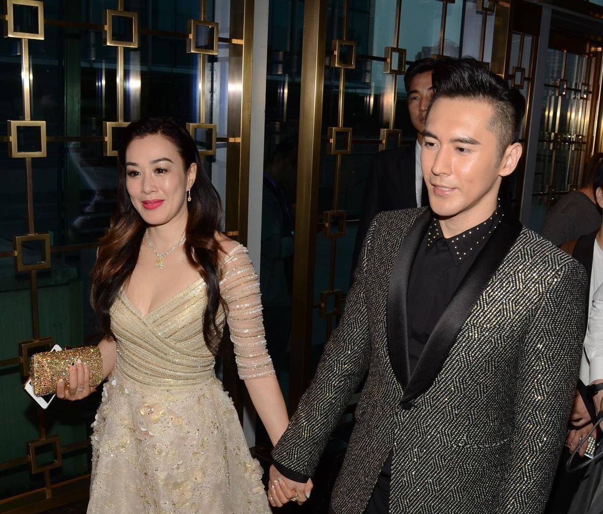 黑色 钟丽缇张伦硕走机场又作妖，身穿老棉袄像大妈，男方眼神生无可恋