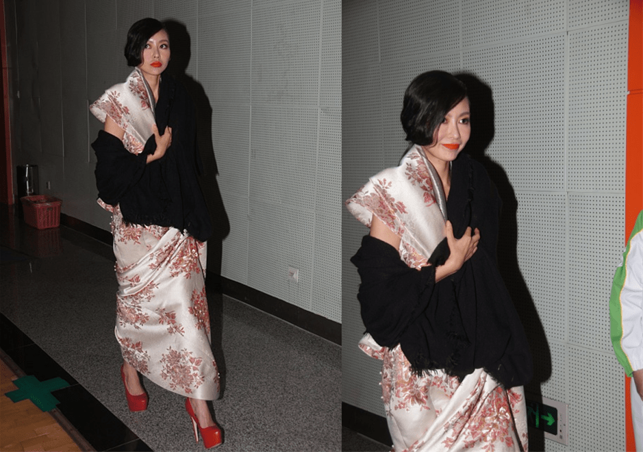 黑色 巩新亮为了上镜也是拼了，穿这么夸张的裙子出席活动，别说还挺美的