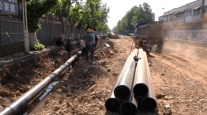 平桥区明港镇:改造升级城市脉络 助力高品质城市建设_施工_道路_王东