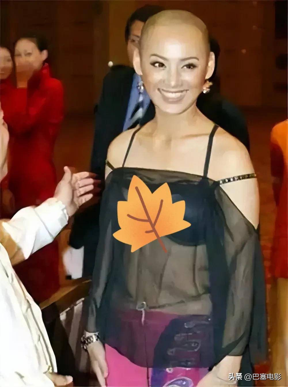 "配合光头造型,视觉冲击力极强.宁静这身衬着黑色胸垫,香肩半露.