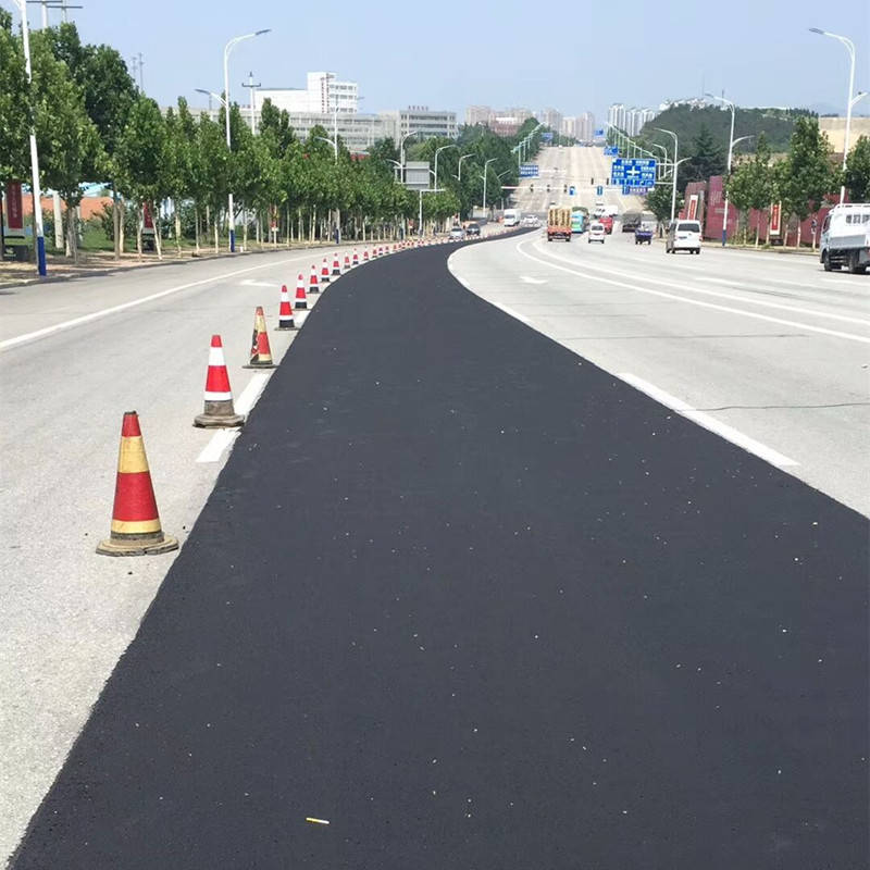 旧路面罩面翻新沥青路面超薄磨耗层修复材料_行车
