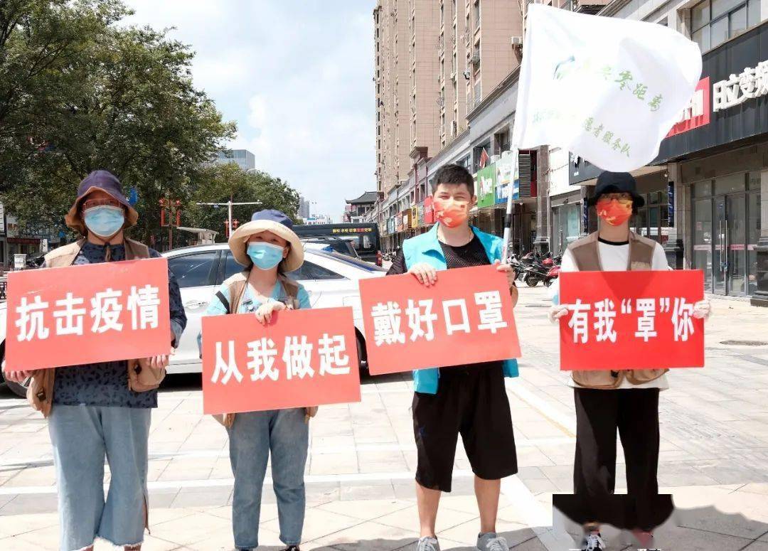 小小口罩传递温暖海安零距离组织志愿者街头助力防疫分发10000个口罩