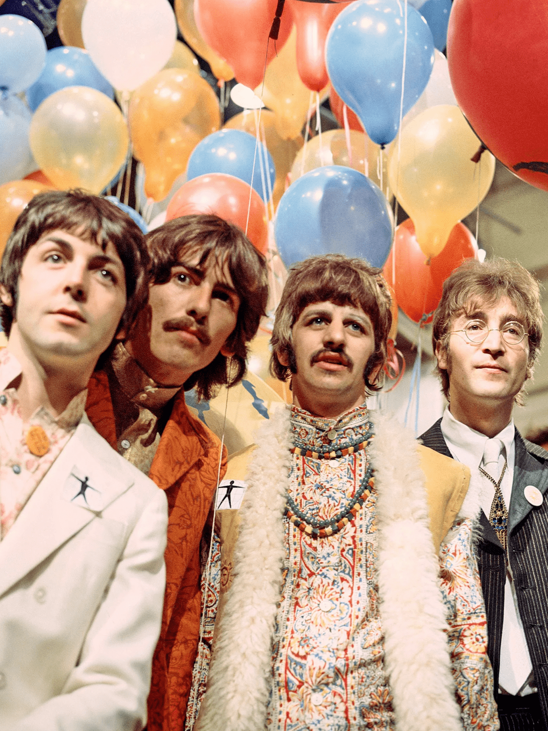 披头士成员包括约翰·列侬,保罗·麦卡特尼,乔治·哈里森和林戈